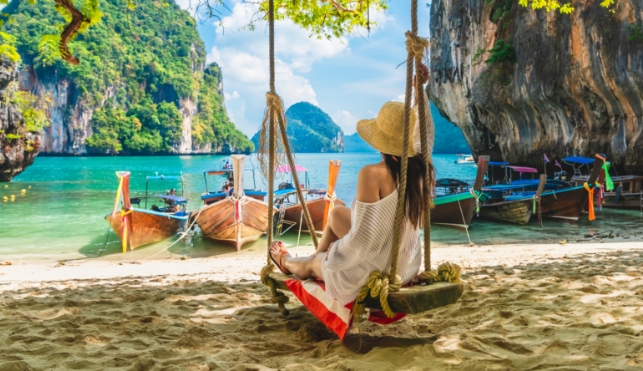 Woman sitting in a hammock in thailand